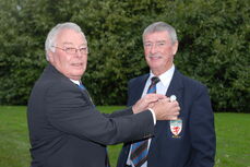 Brian (left) gives badge of office to Alf Palmer (right)